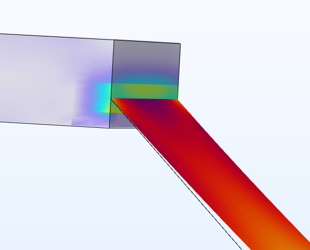 A close-up view of a block with a prism color distribution and a slanted shell in red connected to the right side.